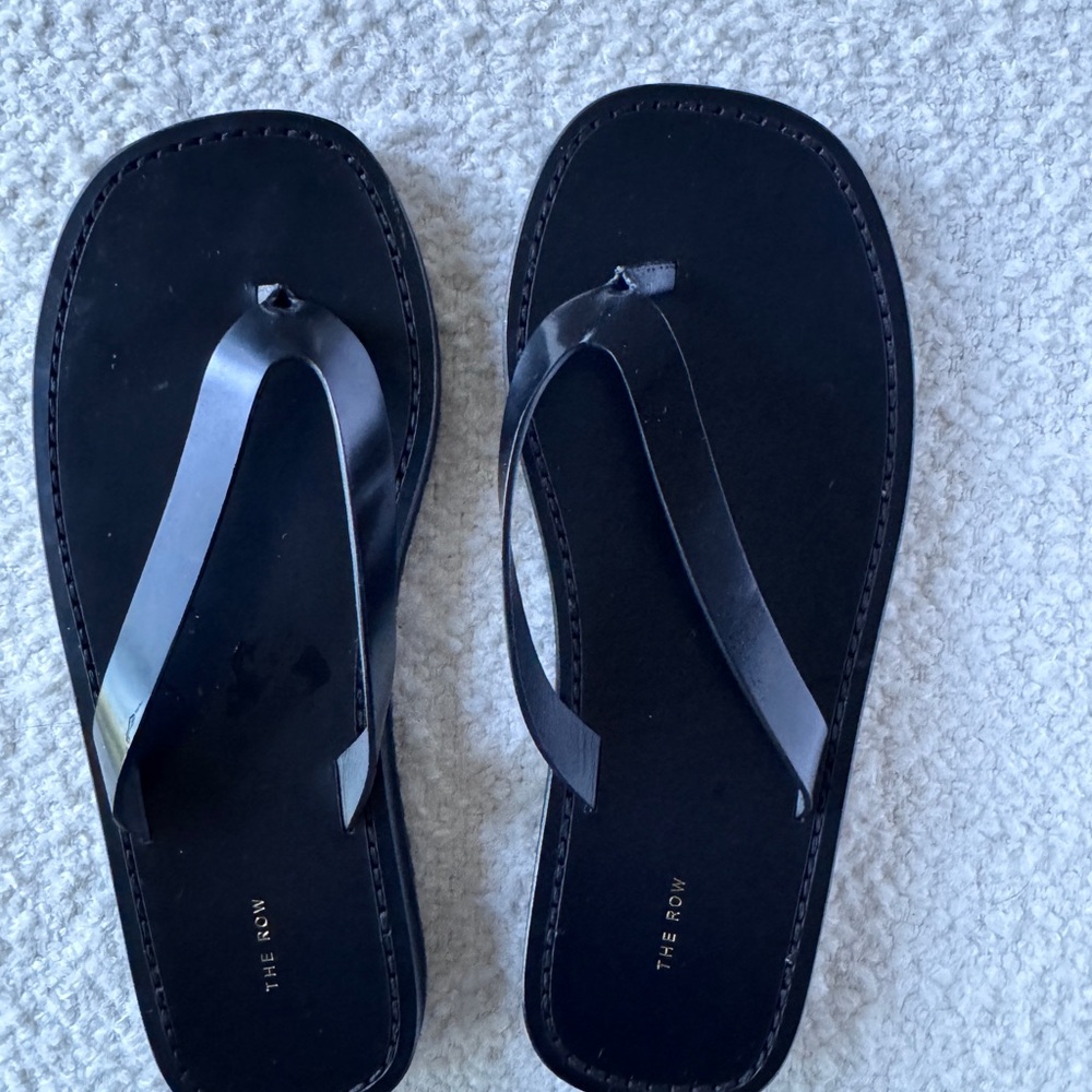 The Row black leather flip flops. brand new never worn.